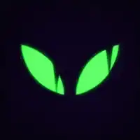 Glowing green alien eyes