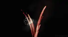 Red fireworks on black background