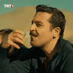 Man drinking tea from glass
