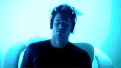People in blue light with headgear