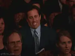 Jerry Seinfeld waving in audience