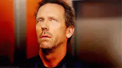 Dr. House looks up and to the side