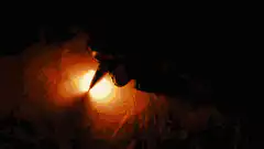 man watching fire burn