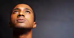 Man looking up thoughtfully