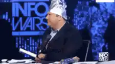 Alex Jones wearing a tinfoil hat