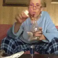 Older woman pours and drinks from a shot glass