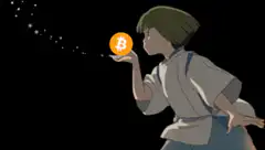 Chihiro holding a Bitcoin
