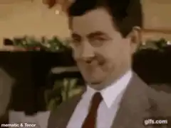 Mr. Bean smirking and sticking tongue out