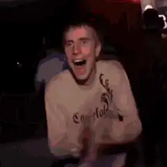Excited man holding up a Bitcoin