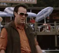 Tom Selleck as Magnum P.I. eating a cookie