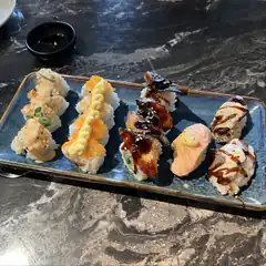 assorted sushi platter on blue plate
