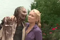 Woman kissing a zombie