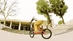 BMX rider jumps down stairs