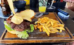 Cheese pull on burger