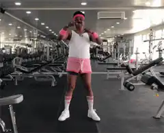 Man in pink shorts dancing in gym