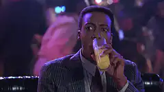 Eddie Murphy drinks and spits out juice