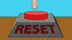Finger presses reset button