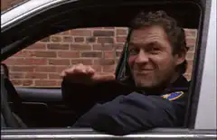 Donnie Wahlberg as Detective Reese waving from car