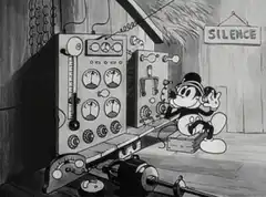 Mickey Mouse operating a vintage machine
