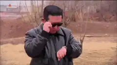 Kim Jong Un checks watch