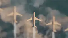 Three wooden airplanes flying in formation