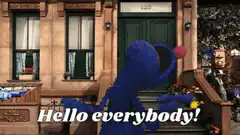 Cookie Monster waving hello