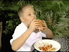 Boy spills ketchup on white shirt