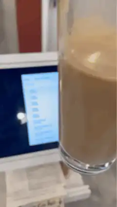 Person scrolling transaction history on tablet