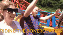 Couple riding roller coaster