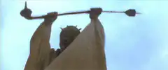 Gamera holding a spear