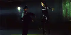 Woman in leather jumps over cop