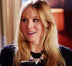 Kristen Bell winking at phone