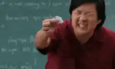 Ken Jeong holding a tiny piece of paper