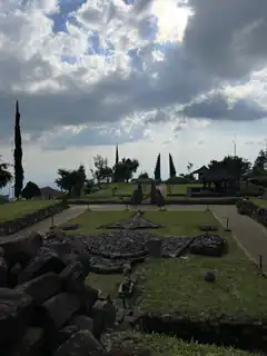 Ancient stone ruins under cloudy sky