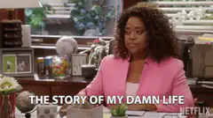 Woman in pink blazer at desk