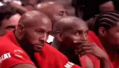 Dwyane Wade and Shaquille O'Neal watching a game