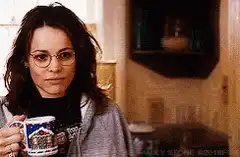 Amy Smart sips coffee and walks away