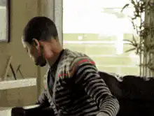Man eating popcorn on couch