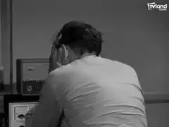 Man rubbing face in frustration