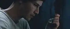 Neo holding the white rabbit pill