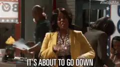 Woman in yellow jacket says it's about to go down