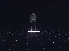 Man dancing on light floor