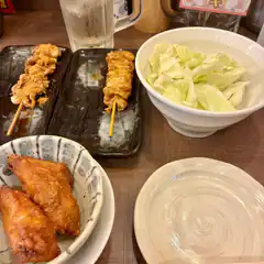 Japanese izakaya meal with yakitori and cabbage