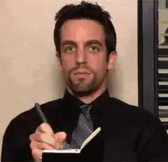 B.J. Novak writing and nodding