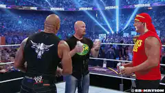 WWE wrestlers spray champagne in ring