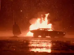 Batman car explosion in rain