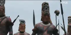 Tribal warriors with masks and spears
