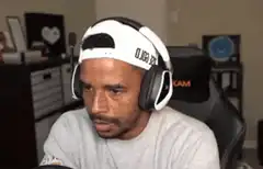 Man in backwards cap looking confused