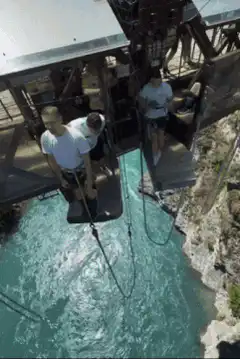 Man bungee jumping off a bridge