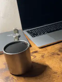 Coffee cup vibrating on desk